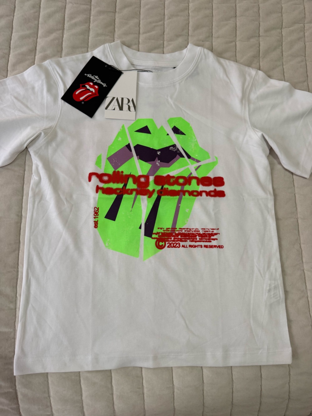 Zara White Rolling Stones T‑Shirt with Neon Green, Purple & Red Graphic